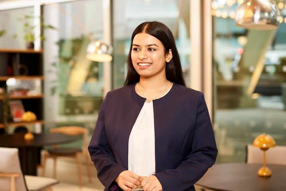Woman smiling in professional setting.