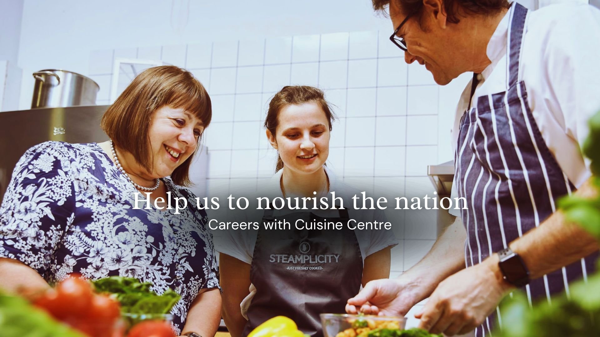 Three people smiling in a kitchen with the text Help us to nourish the nation and Careers with Cuisine Centre.